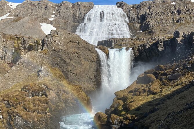 A rainbow standing in the spray at the foot of Dynjandi